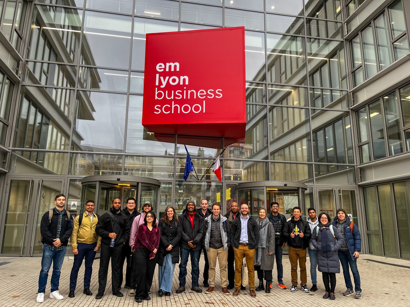 Graduate Students in front of the Em Lyon Business School.